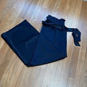 Baccarri, elegant solid navy blue satin paper bag high waist pants. Size Large.